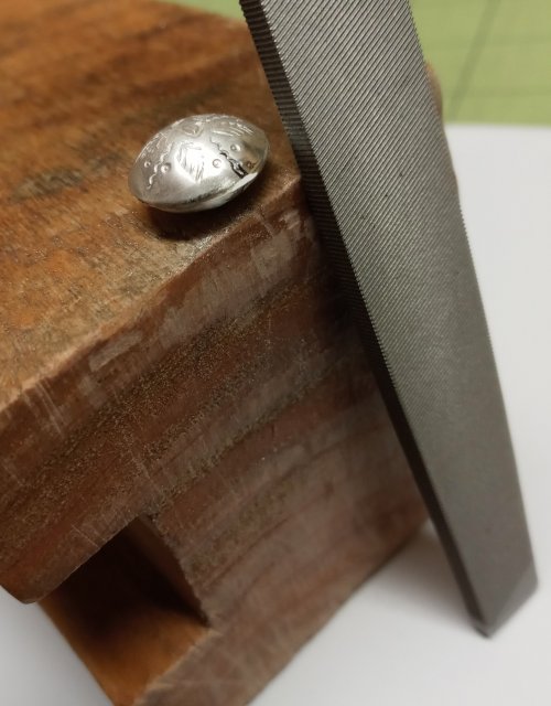 Judy Larson's Little Saucer Bells - , Contemporary Wire Jewelry, Dapping, Dapping Jewelry, Stamping, Stamps, Texturing, Butane Torch, Soldering, Solder, Filing a very small flat area 